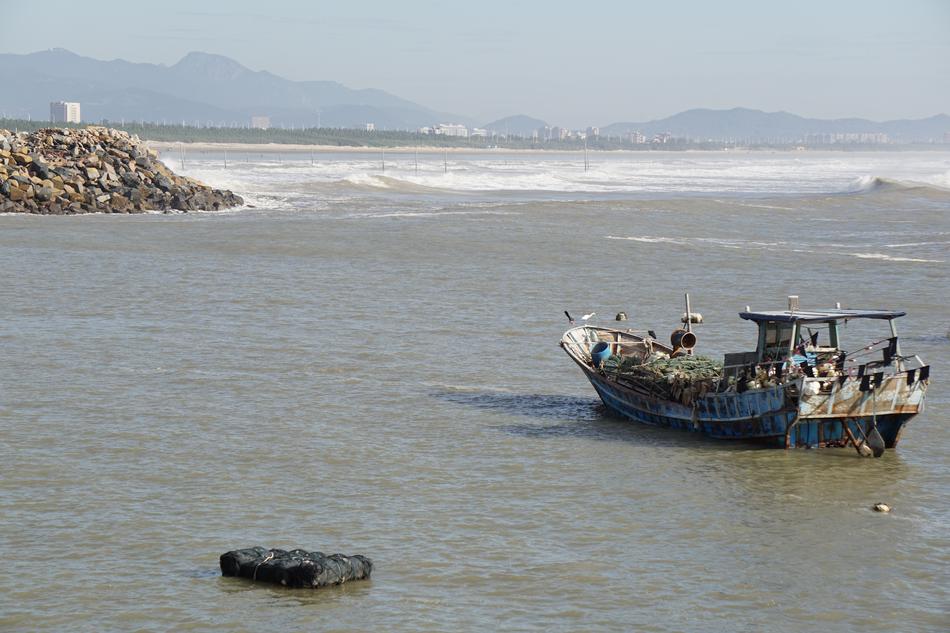 fishing boat by the beach by the sea