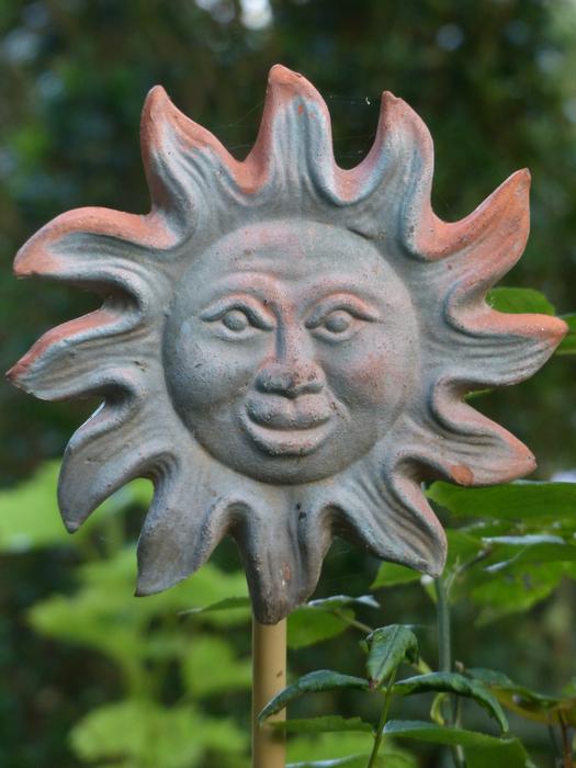 stone sun in the garden