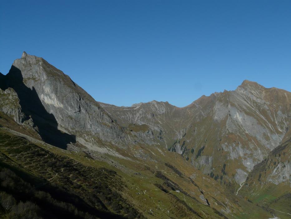 green cliffs against a blue sky