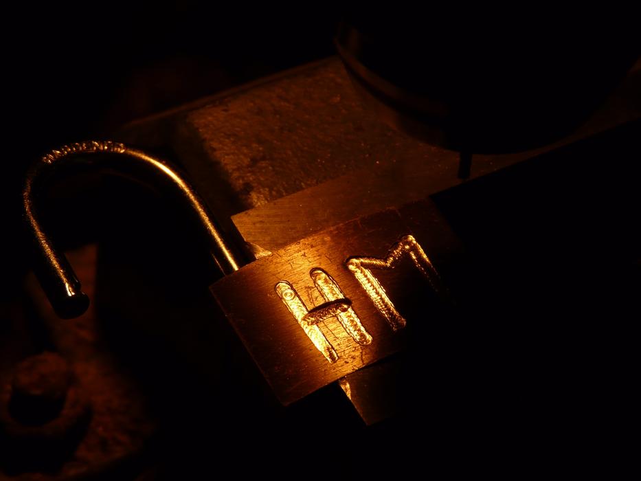 open lock with gold lettering