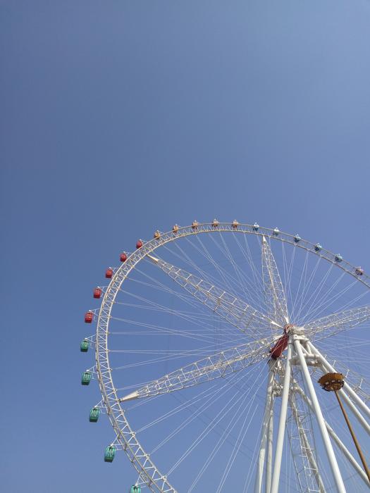white Ferris wheel against the sky