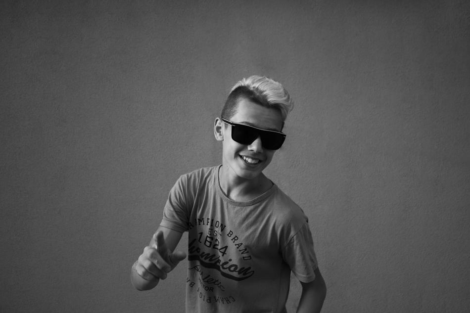 the happy guy with the black glasses
