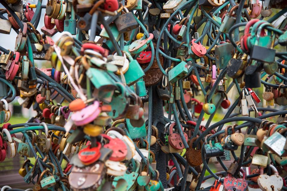 a bunch of love locks on the fence