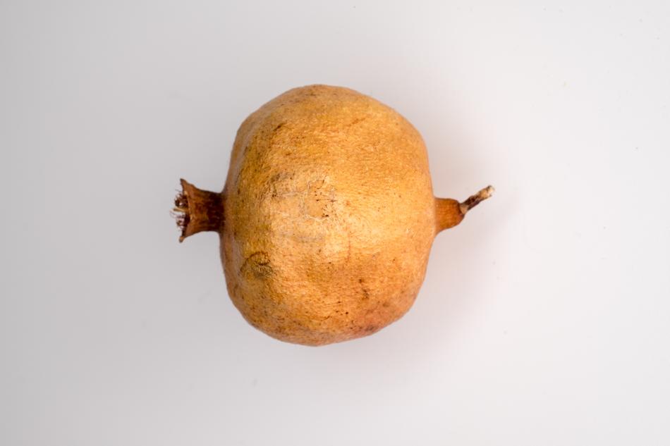 ripe pomegranate on a white background