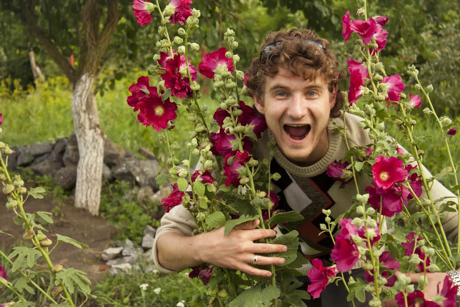 happy guy in flowers