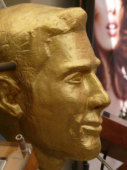 golden sculpture male profile