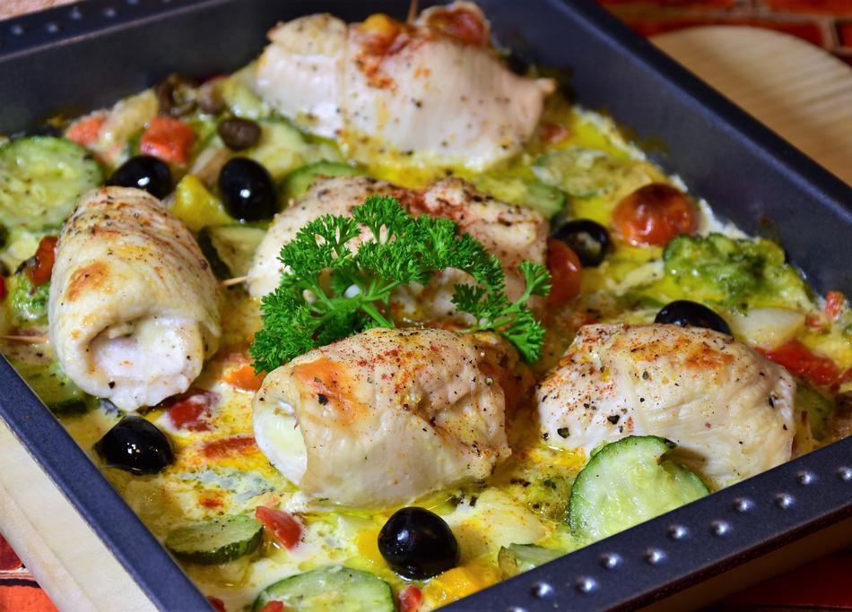 Beautiful and colorful chicken roulades, with the vegetables and sauce