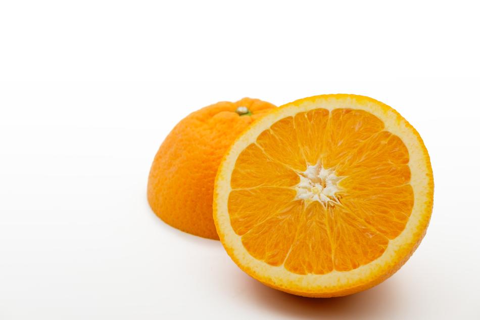 photo of ripe orange on a white background