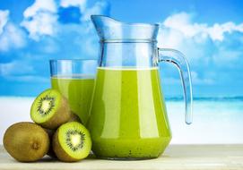 ripe kiwi and kiwi juice in jug