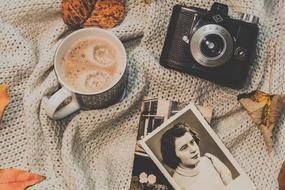 cup with coffee among vintage things