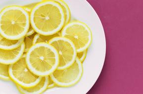 sliced lemon on the white plate