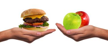 hands with healthy and unhealthy food