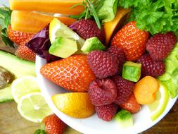 healthy fresh fruits with avocado and lemon