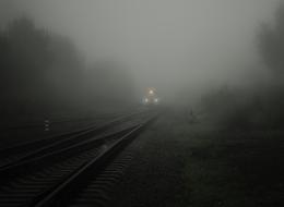 train with fog lights on rails