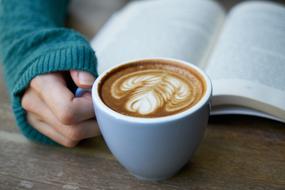 read a book and a cup of cappuccino