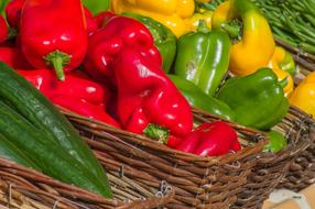 colorful fresh Peppers in baskets on Market stall