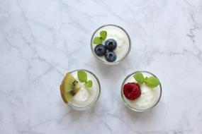 Yogurt with Berries in glasses, top view