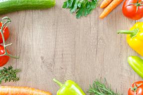 Wooden background with Fresh colorful vegetables