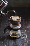 making coffee on a wooden table