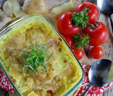 vegetarian potato casserole and ripe tomatoes