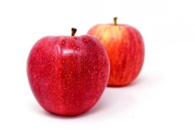 big ripe apples on white