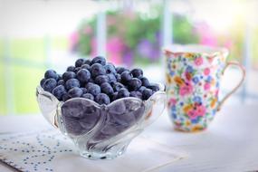 appetizing Berries in a glass bowl on the table