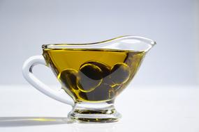 olives float in olive oil