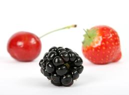 blackberries, cherries and strawberries on a white background