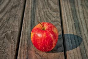 ripe red apple on the table