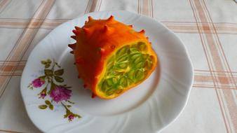 half exotic fruit on a plate