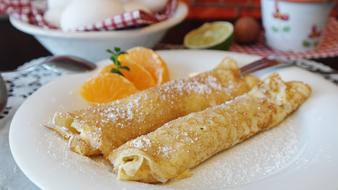 Pancakes with sugar on plate