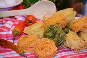 uncooked Tagliatelle, colorful traditional italian Pasta