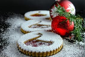 Christmas sponge cake with powdered sugar and colorful Christmas decorations