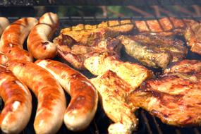 sausages and poultry on Grill