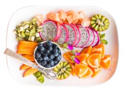exotic fruits on a white plate