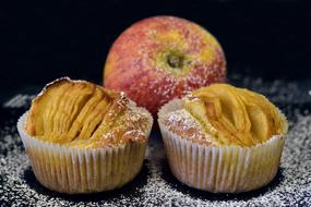 Beautiful and colorful apple and apple pies at black background