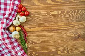 Tomatoes and mushrooms on a wooden Table