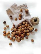 walnuts, canvas bags and rope on the table