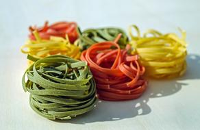 Colorful and beautiful tagliatelle pasta in light