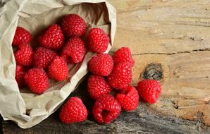 sprinkled red ripe raspberries