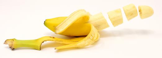 Splendid cut banana fruit at white background