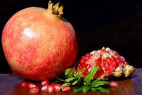 unripe pomegranate on the table