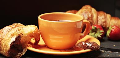 croissants with chocolate and a cup of coffee