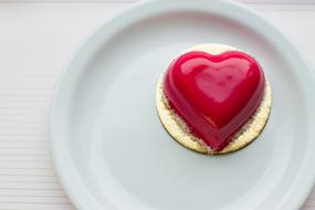 red heart shape topping on cookie