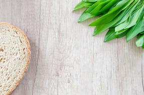 closeup photo of white bread and greens on the table