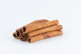 aromatic cinnamon sticks on a white background