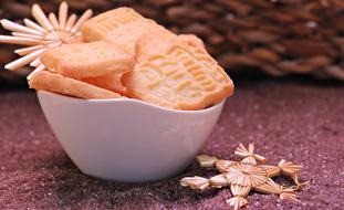 delicious cookies in a white bowl on the table