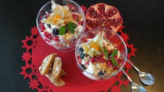 Desserts in glass and pomegranate