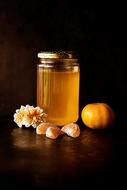 Honey in Jar and flowers