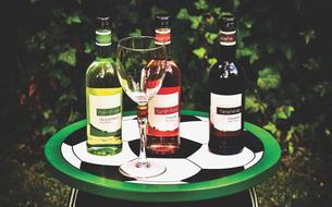 white, red and pink wines beverages on the table